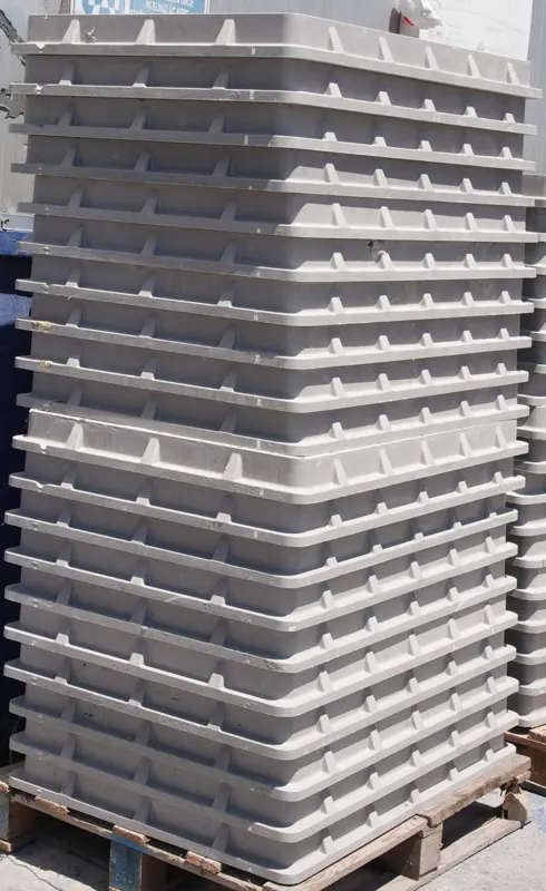 Close-up of stacked composite covers showing the ribbed structural geometry.
