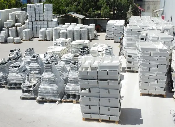 Elevated wide view of the outdoor stock yard with organised pallets of composite components.